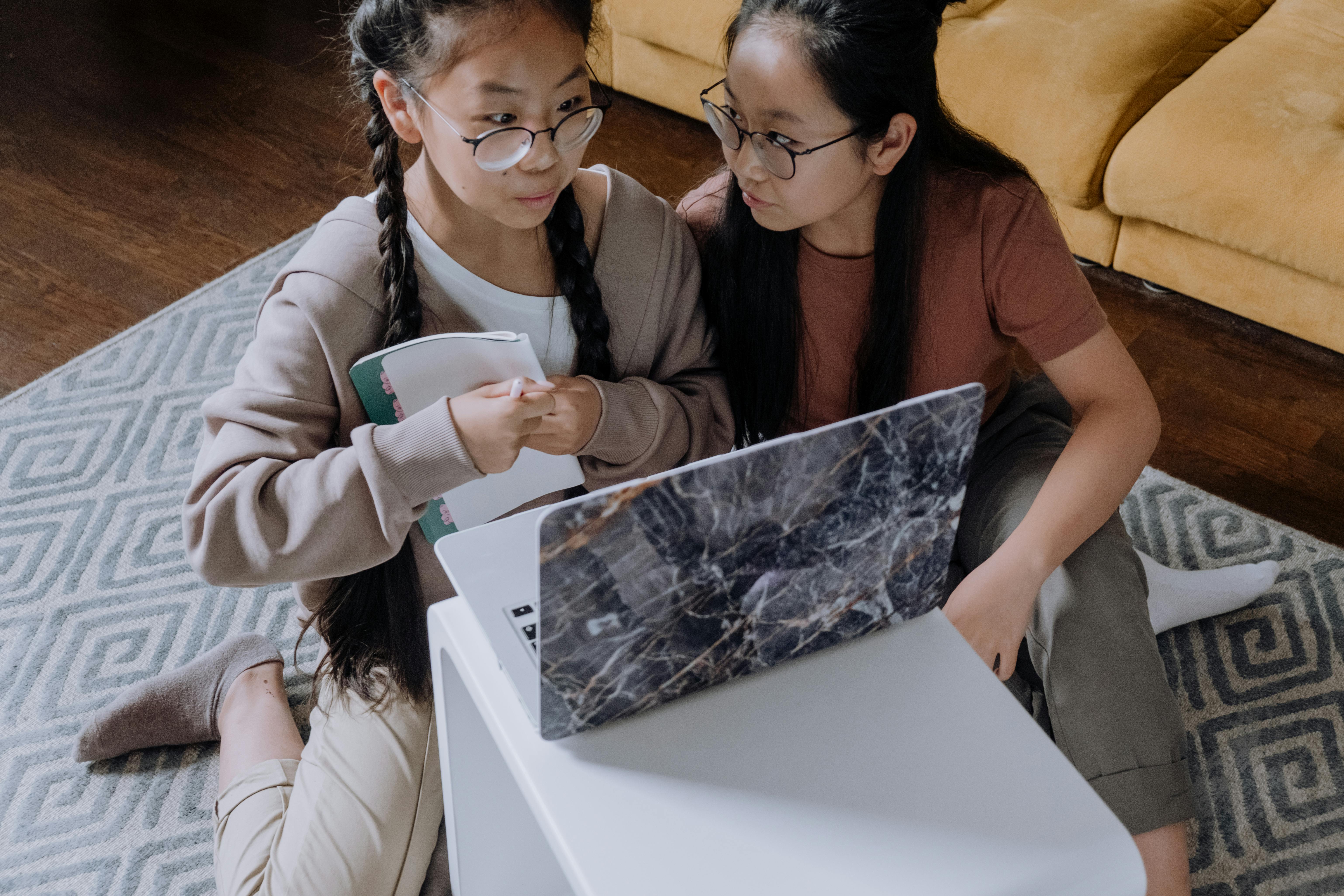 Two students collaborating on their assignments